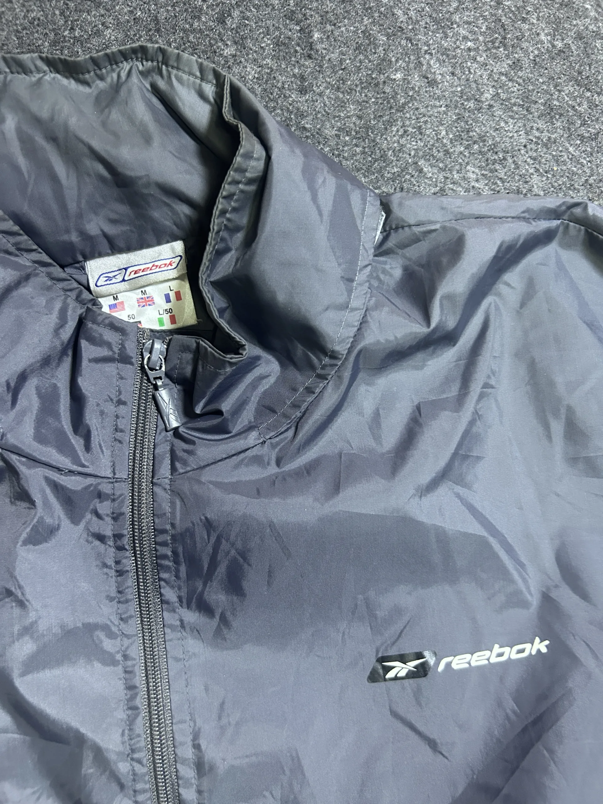 Reebok Grey Lightweight Waterproof Packable Hooded Windbreaker Jacket | Size L