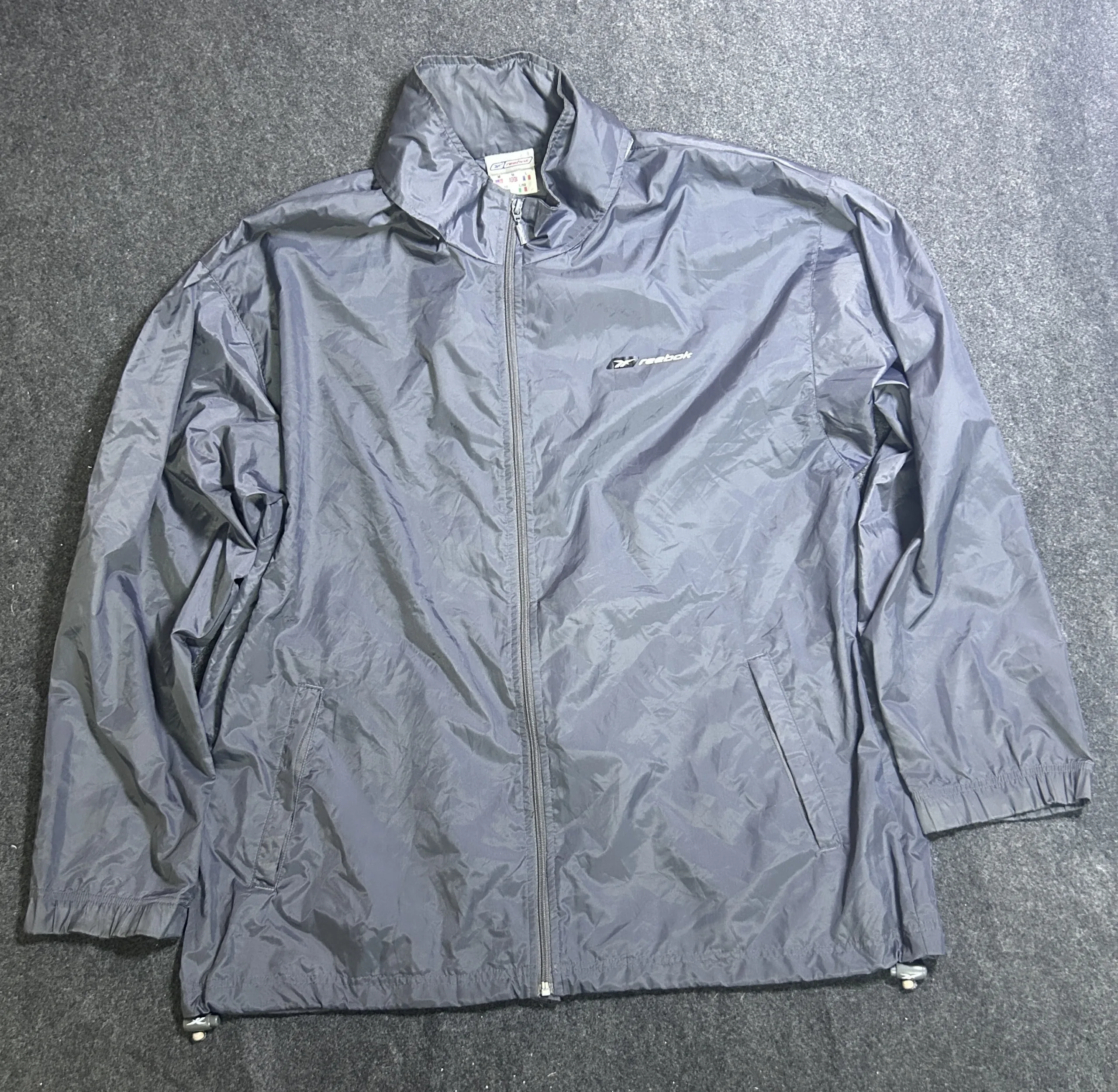 Reebok Grey Lightweight Waterproof Packable Hooded Windbreaker Jacket | Size L