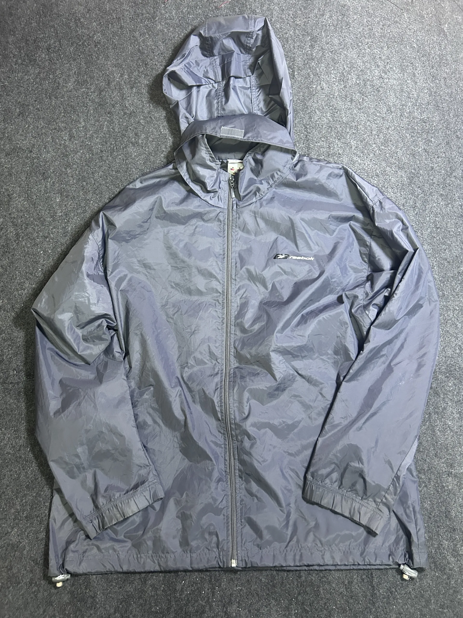 Reebok Grey Lightweight Waterproof Packable Hooded Windbreaker Jacket | Size L