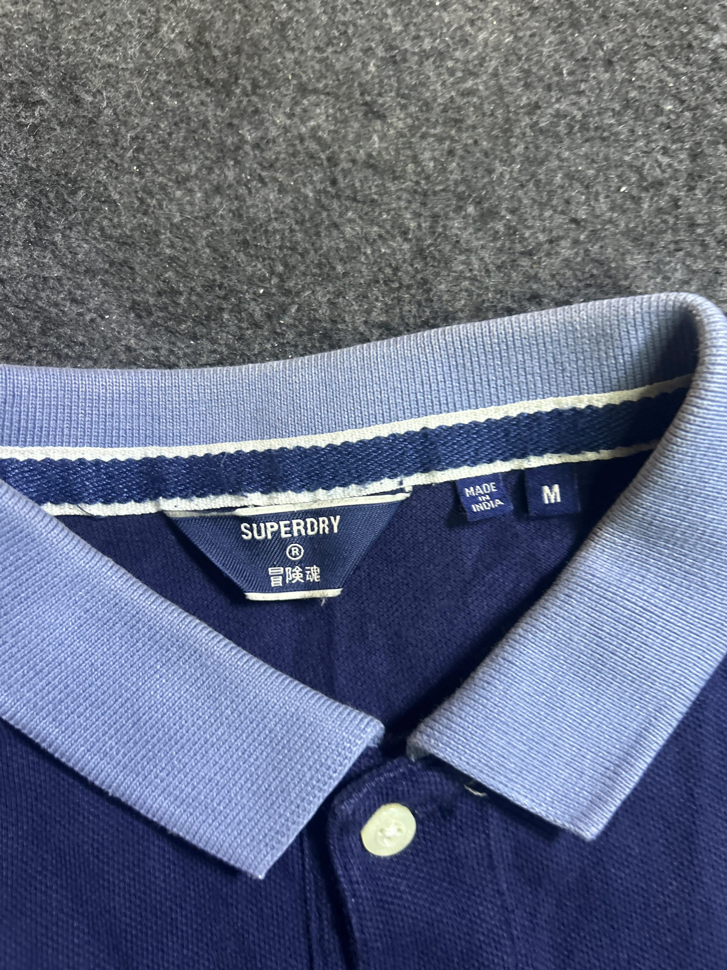 Superdry thrift polo shirt India close-up