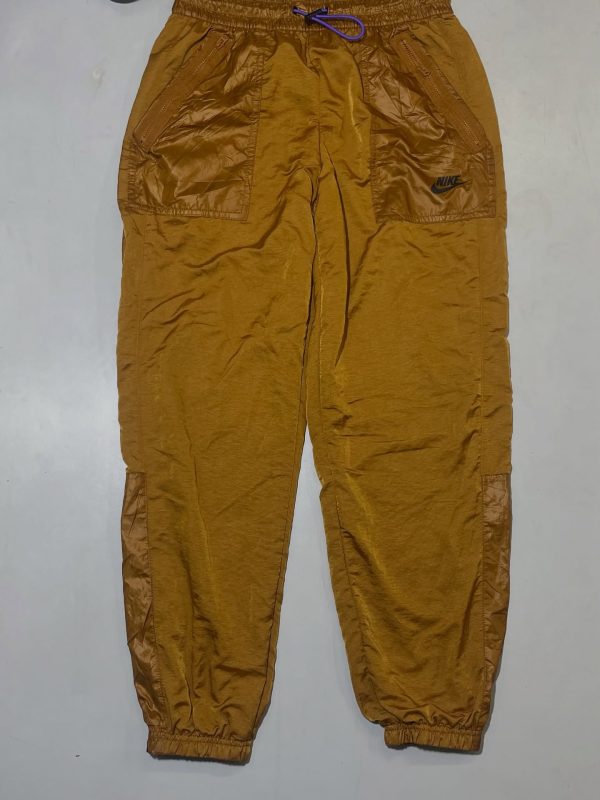 Nike golden track pant with inner net size S 

Waist 28
Length 38

Price DM or w
