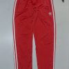 Adidas Red Track Pant Size S with down zipper 

Waist 26-28
Length 40 

Conditio