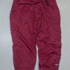 Nike dark red baggy track pant with inner net size S 

Waist 26-32

Length 41
