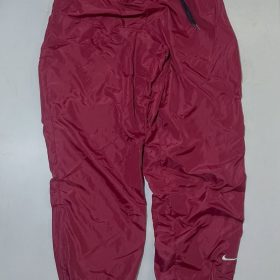 Nike dark red baggy track pant with inner net size S 

Waist 26-32

Length 41
